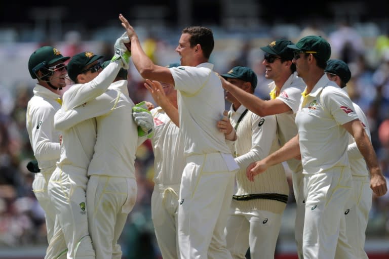 Australian bowler Josh Hazlewood (C) celebrates with teammates after dismissing England's Mark Stoneman on day four of the third Ashes Test