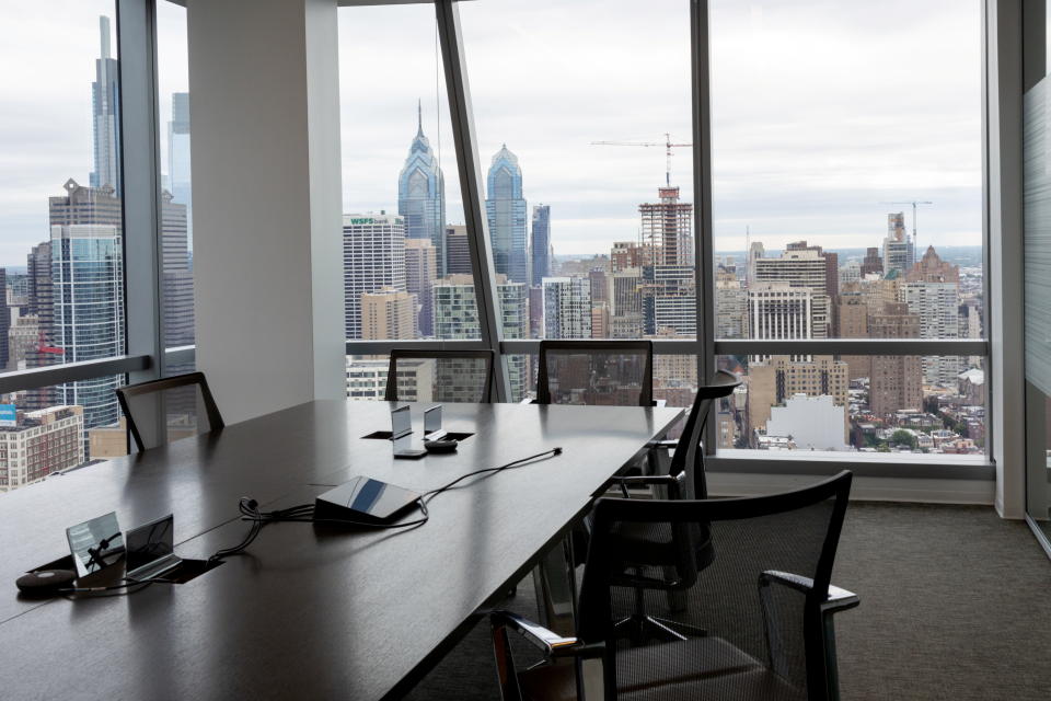 An empty conference room overlooks the Philadelphia skyline.
