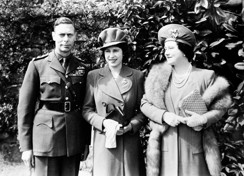 <p>Princess Elizabeth stands with her parents shortly before her 18th birthday (PA Archive) </p>