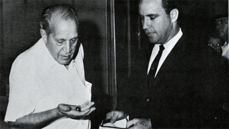 John D. MacArthur and state Sen. Jerry Thomas with the DeLong Ruby at the Vault of First Marine Bank.