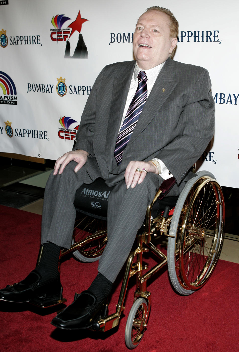 FILE - Hustler magazine founder Larry Flynt poses for photographers on the red carpet during the RainbowPUSH Coalition 10th annual awards dinner celebrating Jesse Jackson's 66th birthday, on Nov. 8, 2007, in Los Angeles. Flynt, who turned "Hustler" magazine into an adult entertainment empire while championing First Amendment rights, has died at age 78. His nephew, Jimmy Flynt Jr., told The Associated Press that Flynt died Wednesday, Feb. 10, 2021, of heart failure at his Hollywood Hills home in Los Angeles. (AP Photo/Danny Moloshok, File)