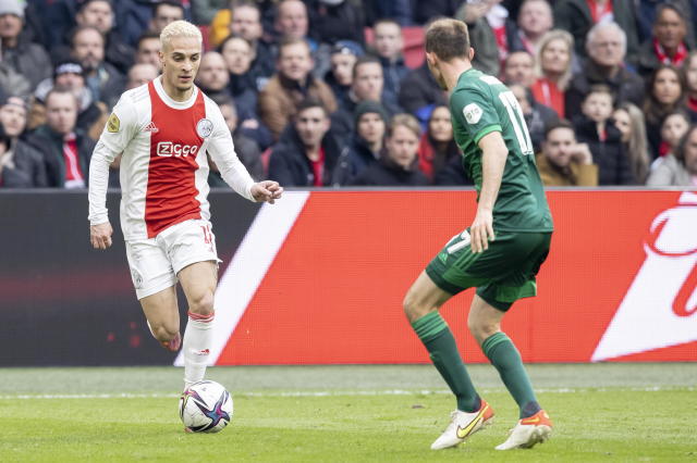AMSTERDAM, NETHERLANDS - MARCH 20: Antony Mattheus dos Santos of AFC Ajax and Lutsharel Geertruida of Feyenoord Rotterdam Battle for the ball during the Dutch Eredivisie match between Ajax and Feyenoord at Johan Cruijff Arena on March 20, 2022 in Amsterdam, Netherlands. (Photo by Michael Bulder/NESImages/DeFodi Images via Getty Images)
