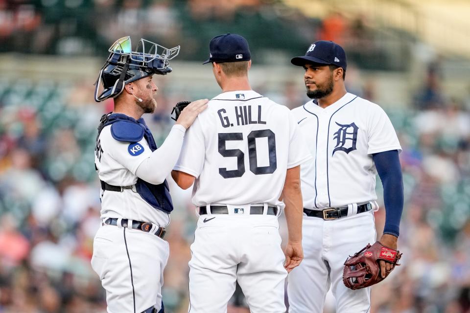 (From left) Tigers catcher Tucker Barnhart, pitcher Garrett Hill and third baseman Jeimer Candelario meet at the mound during the top of the third inning on Tuesday, July 26, 2022, at Comerica Park.
