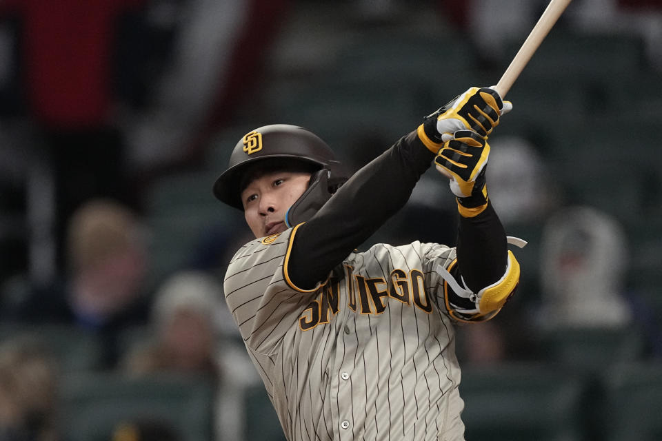 San Diego Padres' Ha-Seong Kim watches a double in the fourth inning of the team's baseball game against the Atlanta Braves, Saturday, April 8, 2023, in Atlanta. (AP Photo/John Bazemore)