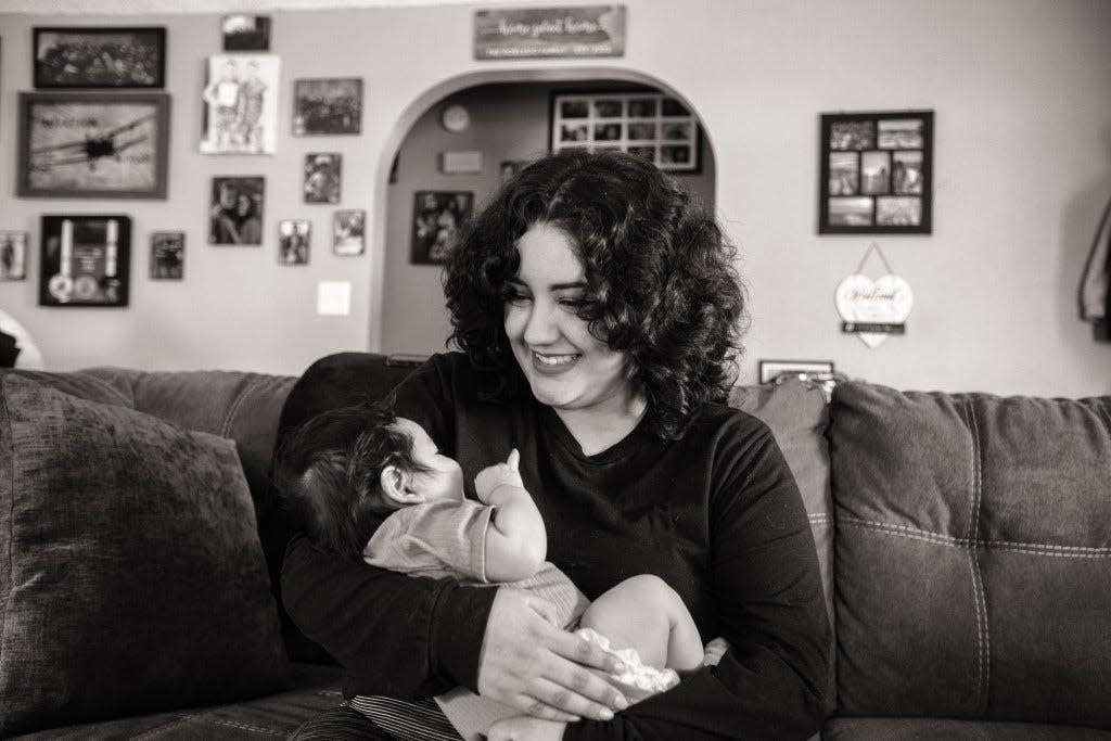 Victoria Robledo holds her new baby, Silas, at home in Clovis.