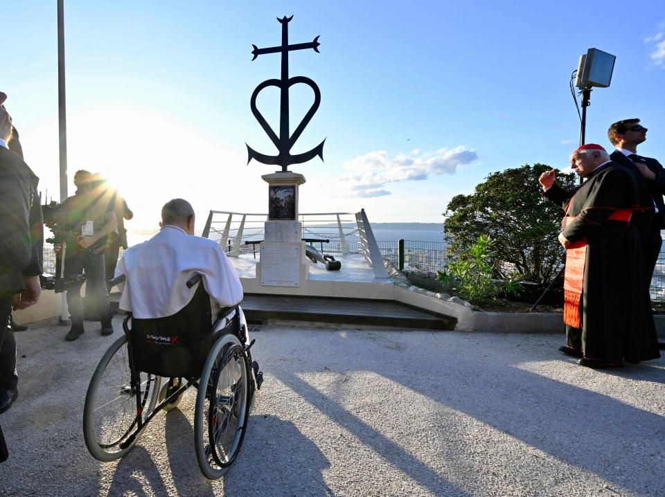 Pope Francis has a moment of reflection in front of the memorial dedicated to sailors and migrants lost at sea, located at the Basilica of Notre-Dame de la Garde in Marseille, France, on Sept. 22. A few days later, the pope published an apostolic exhortation, “Laudate Deum,” his second official warning on the serious threats presented by climate change.