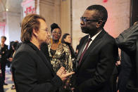 Senegalese singer Youssou N'dour, right, speaks with Irish rock band U2 singer Bono at the City Hall of Lyon, central France, Wednesday Oct.9 2019, ahead of the two-day conference of Global Fund to Fight HIV, Tuberculosis and Malaria. (Olivier Chassignole, Pool via AP)