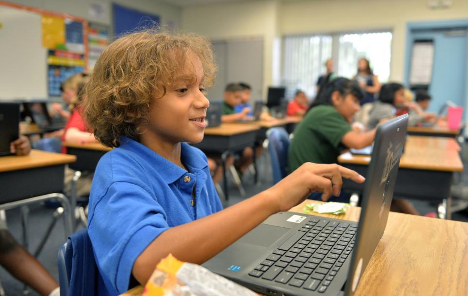 Third-grader Hezekiah Quamina, 8, participates in a class-wide computer game on July 20 at Alta Vista Elementary School’s summer Eagle Academy.
