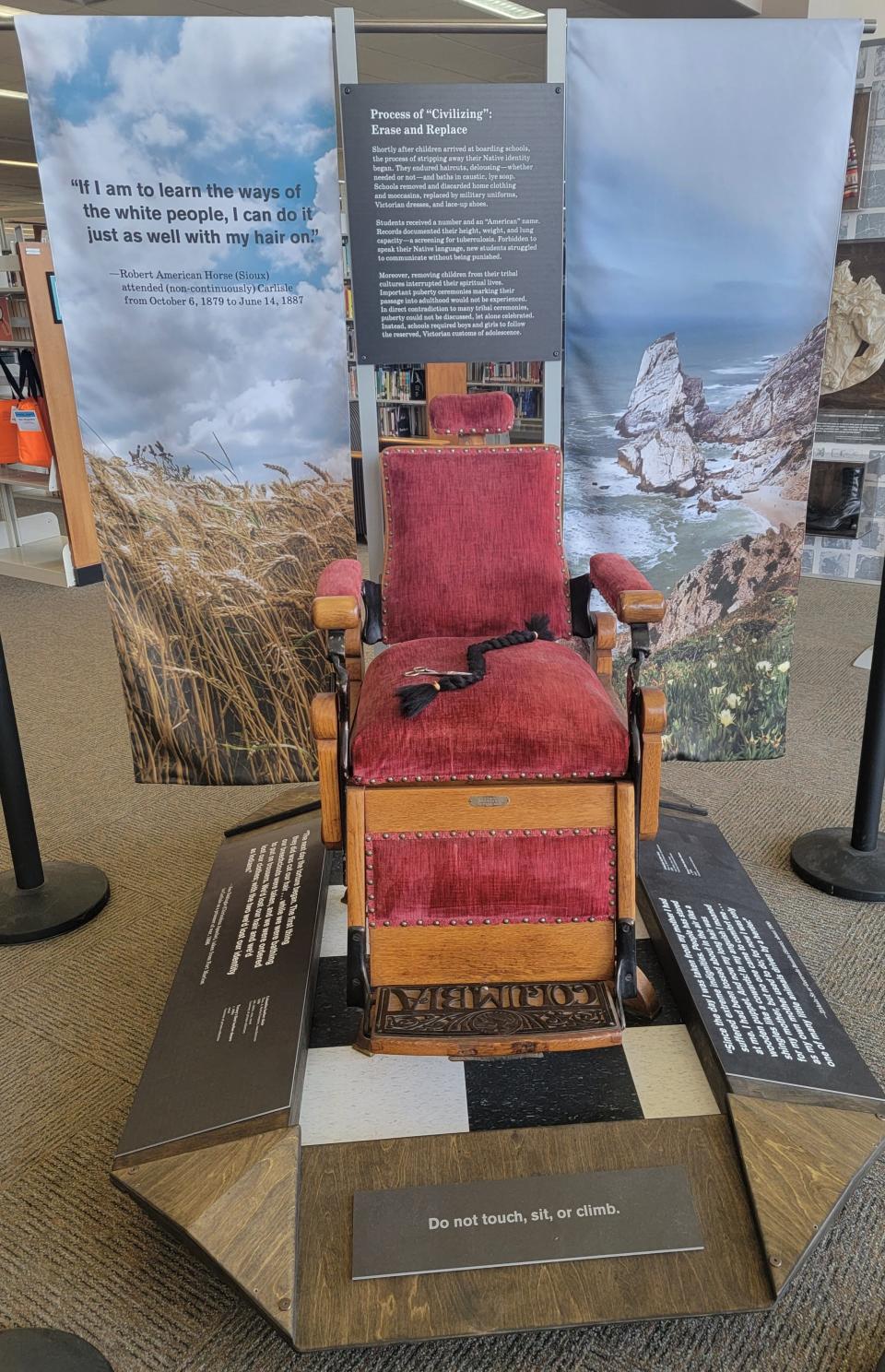 Barber chair on display at Manitowoc Public Library as part of the National Endowment for the Humanities On the Road Exhibition on American Indian boarding schools. The exhibit runs through Aug. 11.