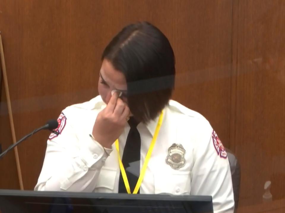 In this image from video, Minneapolis Firefighter Genevieve Hansen wipes her eyes as she testifies Tuesday, March 30, 2021.