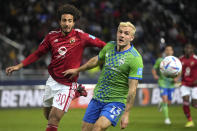 Al Ahly's Mohamed Hany, left, challenges for the ball with Jordan Morris, of Seattle Sounders FC, during the FIFA Club World Cup soccer match between Seattle Sounders FC and Al Ahly FC at the Tangier stadium, in Tangier, Morocco, Saturday, Feb. 4, 2023. (AP Photo/Mosa'ab Elshamy)