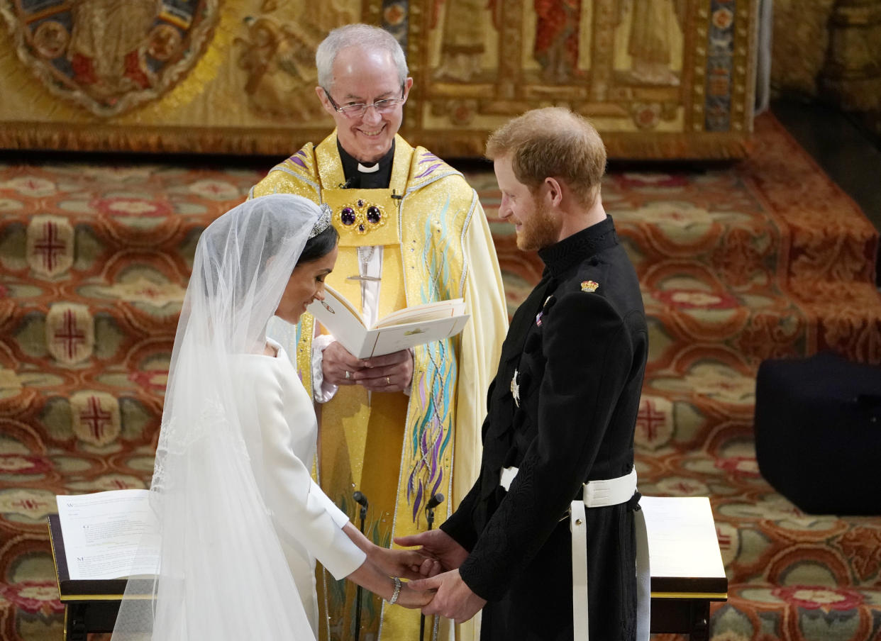 Prince Harry and Meghan Markle exchange vows in St George's Chapel at Windsor Castle during their wedding service, conducted by the Archbishop of Canterbury Justin Welby.