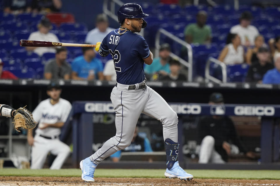 Tampa Bay Rays' Jose Siri (22) hits a single in the fifth inning of a baseball game against the Miami Marlins, Tuesday, Aug. 30, 2022, in Miami. (AP Photo/Marta Lavandier)