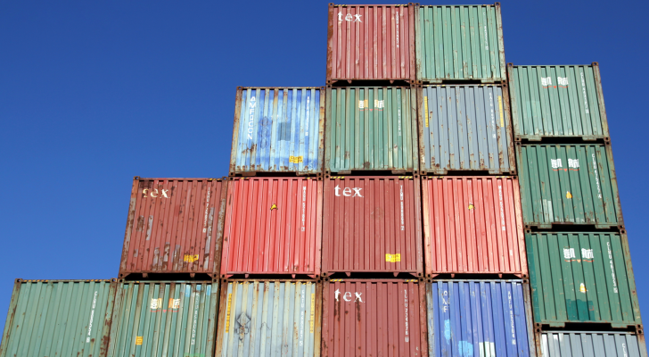 Plenty of shipping containers stacked at the Port of Hamburg and blue sky