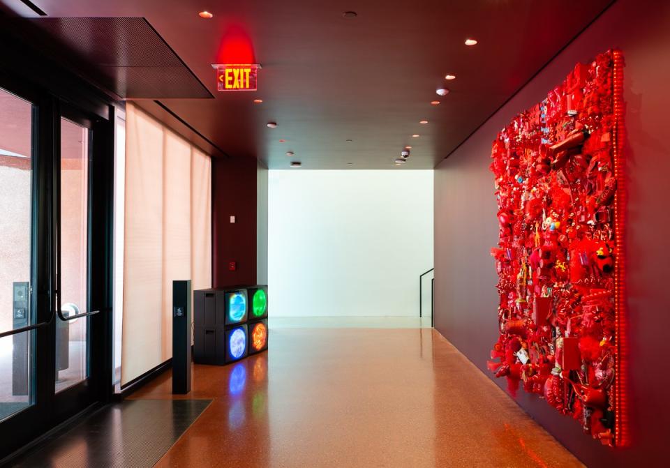 The entry is a deep red, designed by Adjaye to allow visitors' eyes to adjust from the bright Texas sun.