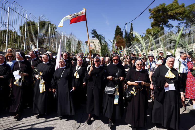 Christian worshippers attend a Palm Sunday procession on the Mount of Olives in Jerusalem