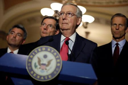 Senate Majority Leader Mitch McConnell, flanked by Sen. Cory Gardner (R-CO), Sen. John Barrasso (R-WY), and Sen. John Thune (R-SD), speaks to reporters after the weekly policy luncheons on Capitol Hill in Washington, D.C., U.S. May 16, 2017. REUTERS/Aaron P. Bernstein