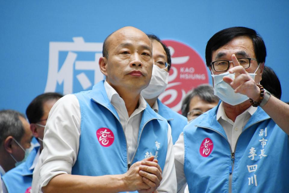 Mayor Han Kuo-yu, center, reacts as he speaks to the media in Kaohsiung, Taiwan, Saturday, June 6, 2020. Residents of the Taiwanese port city of Kaohsiung voted Saturday to oust their mayor, whose failed bid for the presidency on behalf of the China-friendly Nationalist Party earlier this year brought widespread disapproval among residents. (Kyodo News via AP)