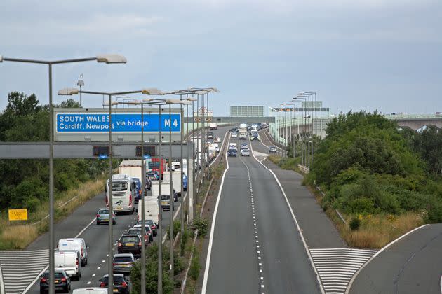 Police escort vehicles across the Prince of Wales Bridge, which runs between England and Wales, during the morning rush hour as drivers hold a go-slow protest on the M4. (Photo: Rod Minchin - PA Images via Getty Images)