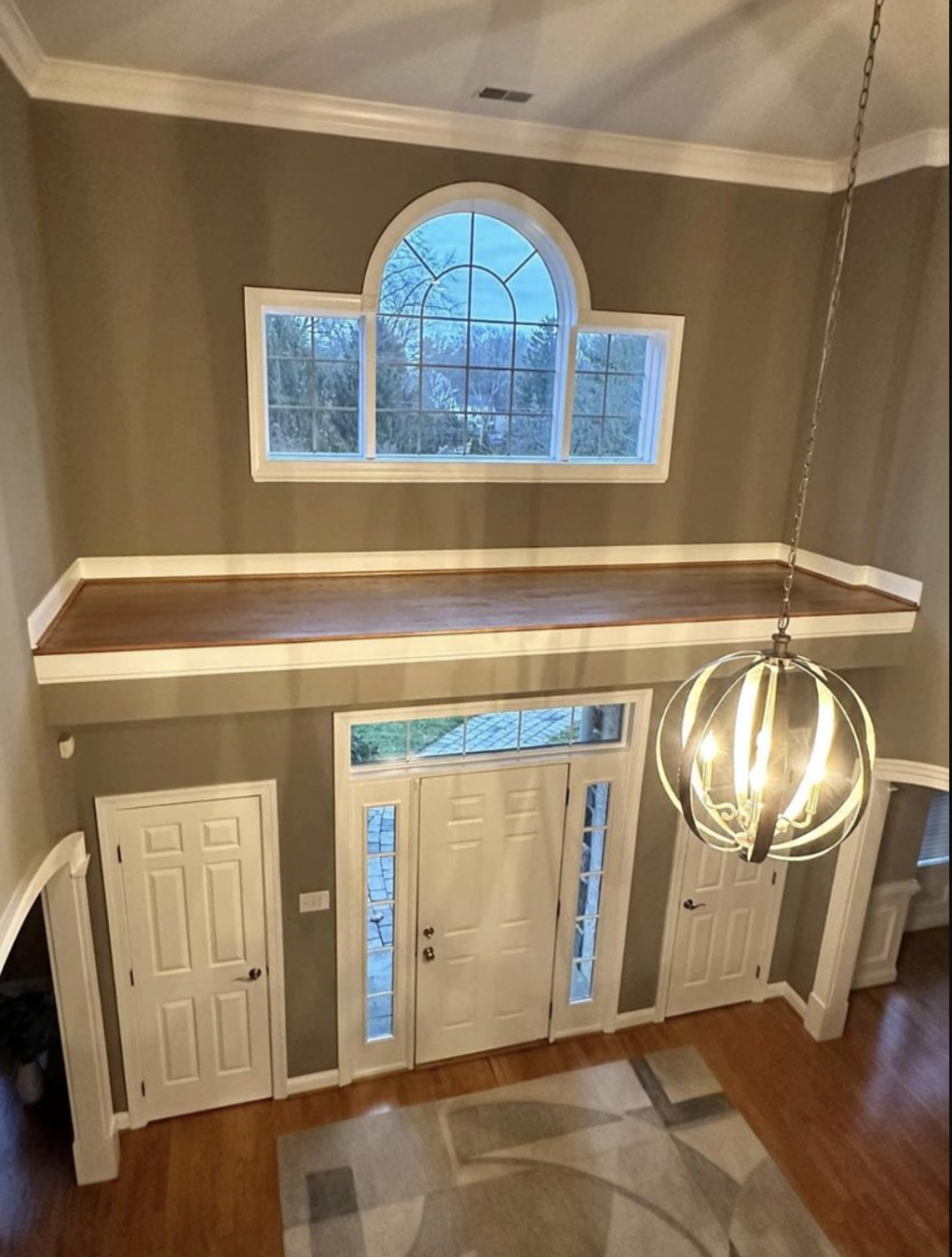 Overhead view of an inaccessible foyer landing above the front door