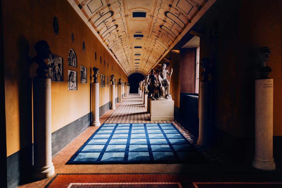 a blue rug in a museum