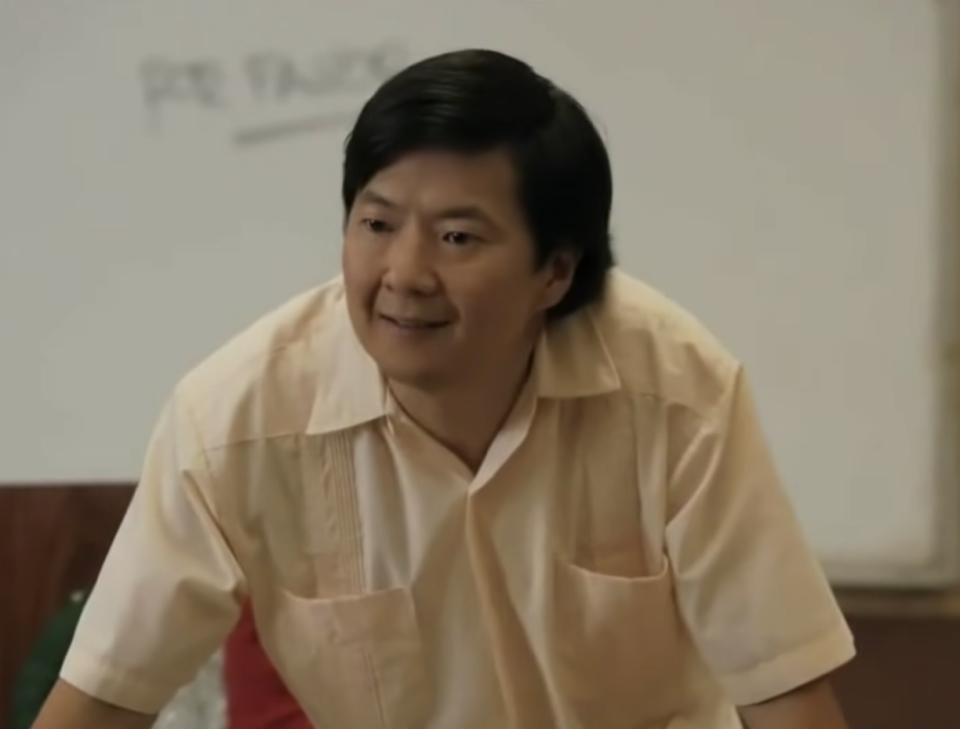 frustrated ben chang leaning over students' desks