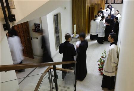 Priests prepare for a mass to be led by Father Eduardo Robles Gil, the new leader of the Legionaries of Christ order, in the order seminary in Rome February 6, 2014. REUTERS/Max Rossi