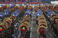 Indian paramilitary soldiers and policemen attend Indian Republic day parade in Srinagar, Indian controlled Kashmir, Sunday, Jan. 26, 2020. The day marks the anniversary of India's democratic constitution taking force in 1950. (AP Photo/Mukhtar Khan)