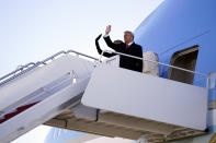 President Donald Trump and first lady Melania Trump board Air Force One at Andrews Air Force Base, Md., Wednesday, Jan. 20, 2021.(AP Photo/Manuel Balce Ceneta)