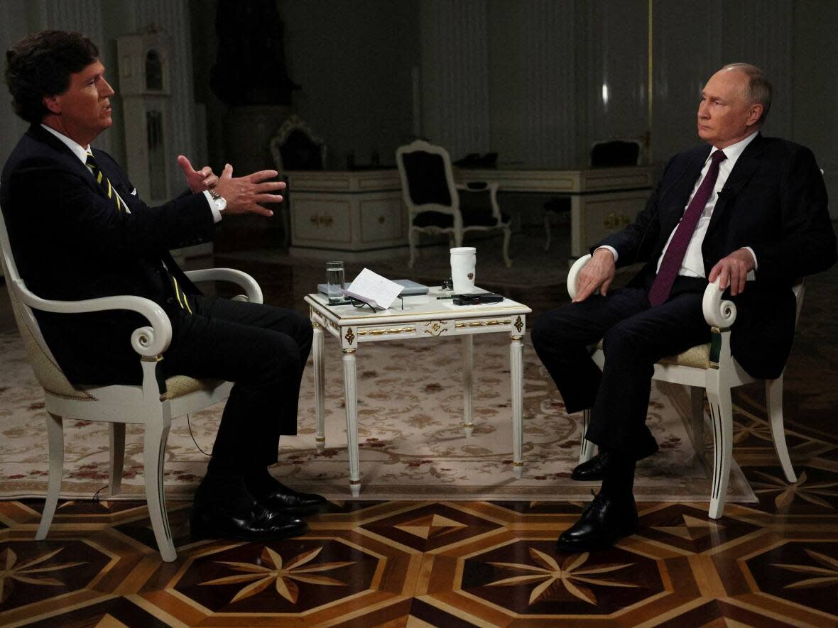 Former Fox News host Tucker Carlson interviewed Russian President Vladimir Putin in Moscow on Feb. 6. The interview aired in Russia early on Friday morning. (Gavriil Grigorov/Sputnik/Kremlin/Reuters - image credit)