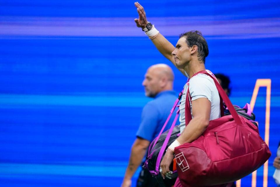 Rafael Nadal, of Spain, waves to fans after his loss to Frances Tiafoe during the fourth round of the U.S. Open tennis championships, Monday, Sept. 5, 2022, in New York. (AP Photo/Julia Nikhinson)