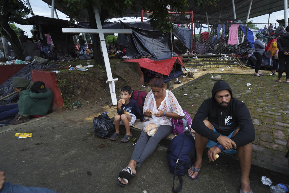 The migrants, many from Central America and Venezuela, sheltered at a sports complex in Huixtla, Chiapas state, Mexico, Wednesday, June 8. 2022. The group left Tapachula this Monday, tired of waiting for their status in a region with little work and far from their ultimate goal of reaching the United States. (AP Photo/Marco Ugarte)