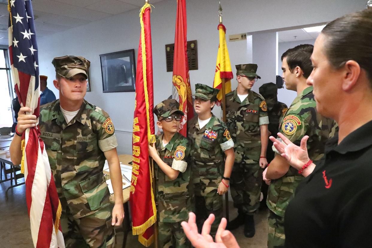Sara Zettlemoyer, far right, unit commander of the newly formed Volusia Young Marines, prepares her unit to present the colors recently at VFW Post 3282 in Port Orange.
