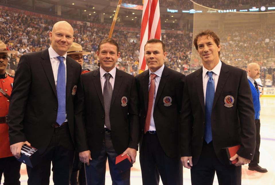 TORONTO, ON - NOVEMBER 11: (L-R) Mats Sundin, Pavel Bure, Adam Oates, and Joe Sakic are presented with Hall of Fame jackets prior to the Hockey Hall of Fame Legends Game at the Air Canada Centre on November 11, 2012 in Toronto, Canada. All four are former NHL players who will be inducted into the Hockey Hall of Fame at a ceremony at the Hall on November 12. (Photo by Bruce Bennett/Getty Images)