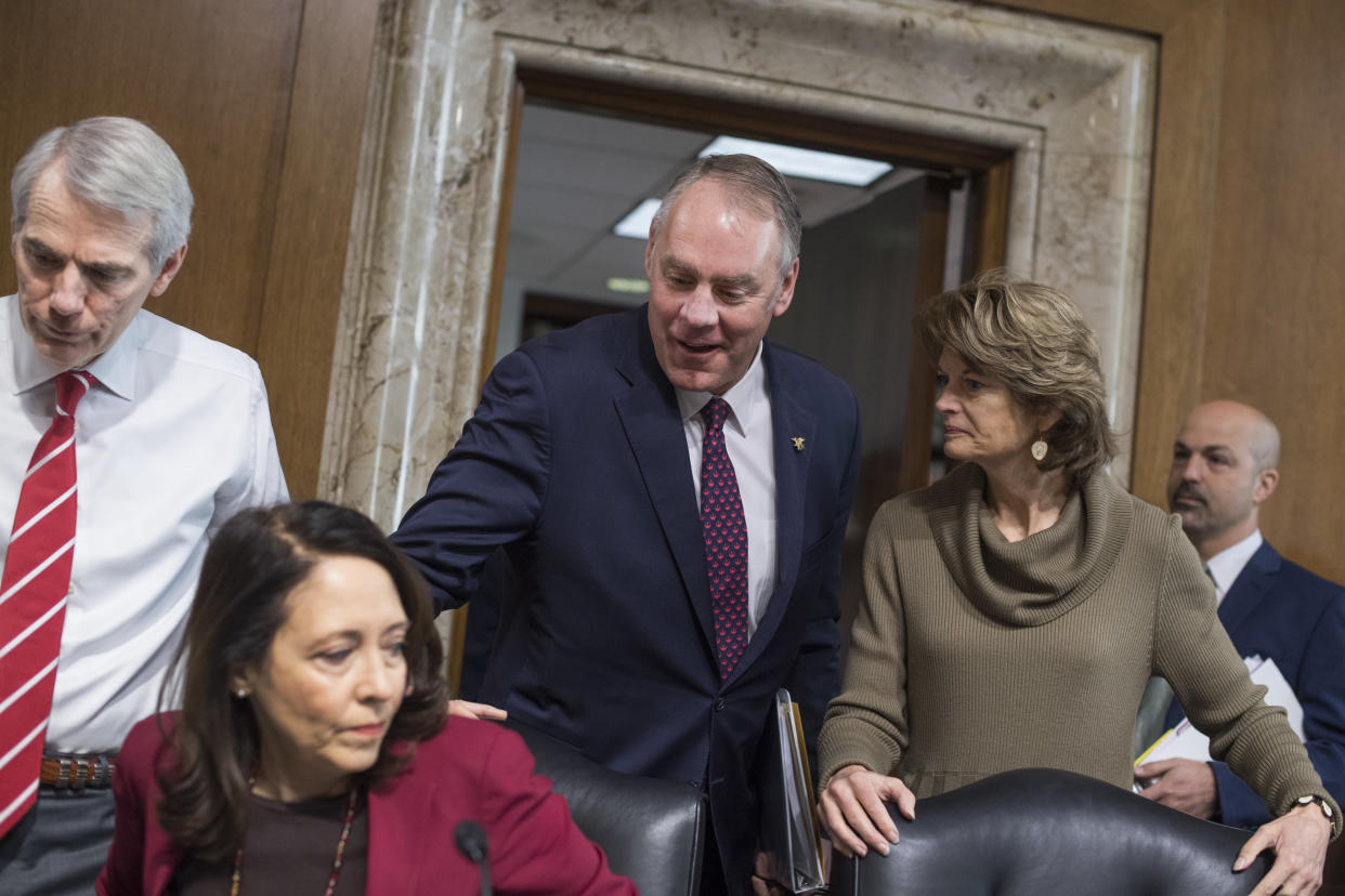 Interior Secretary Ryan Zinke, center, arrives to testify at a Senate Energy and Natural Resources Committee hearing on Tuesday.&nbsp;Also&nbsp;pictured&nbsp;are Chairwoman Lisa Murkowski (R-Alaska) (right), Sen. Maria Cantwell (D-Wash.) and Sen. Rob Portman (R-Ohio) (left). (Photo: Tom Williams via Getty Images)