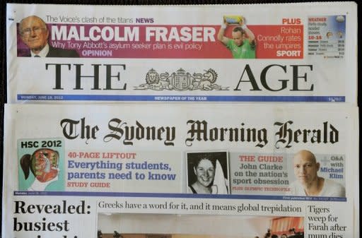 The front pages of Australian media giant Fairfax's newspapers "The Age" and "The Sydney Morning Herald" are displayed in Sydney on June 18, 2012. The Australian media sector is enduring a turbulent period, with the two major newspaper groups Fairfax and Rupert Murdoch's News Limited both flagging large job cuts as they grapple with the challenges of the digital transition