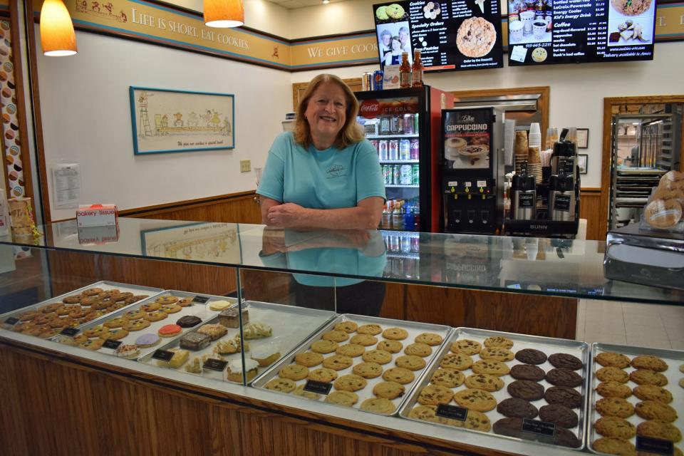 Mary Jo Banwart, owner of Cookies, etc., poses at her shop at North Grand Mall in Ames. She plans to install a Cookie ATM outside TJ Maxx this week.