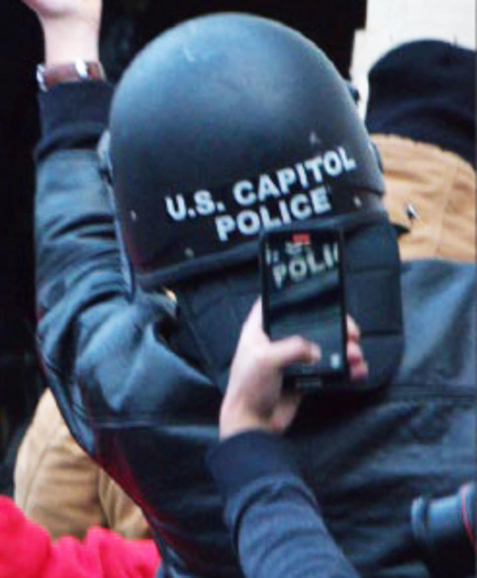 Richard Zachary Ackerman wearing the U.S. Capitol Police helmet. (U.S. District Court)