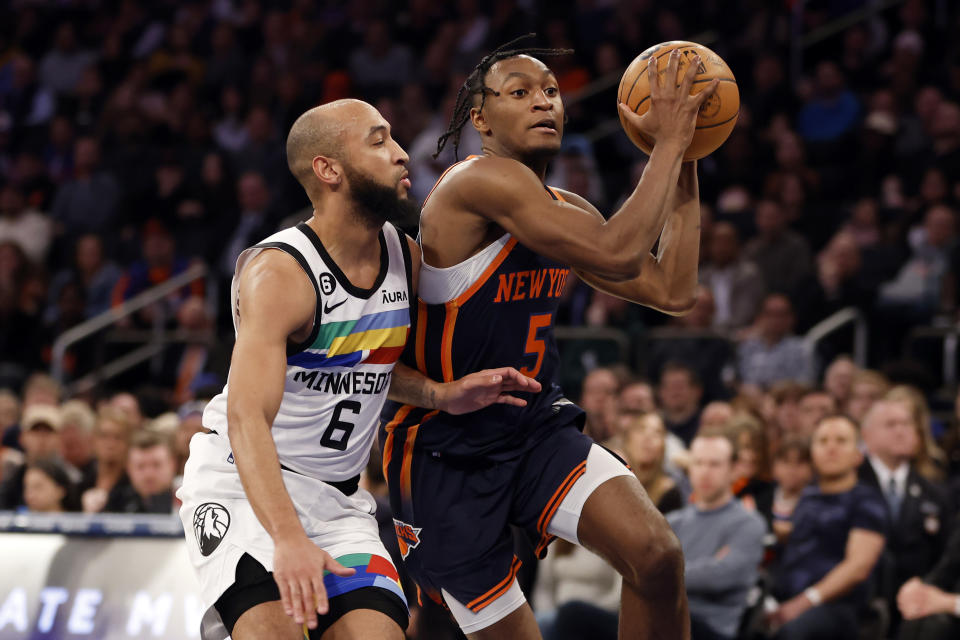 NEW YORK, NEW YORK - MARCH 20: Immanuel Quickley #5 dribbles against Jordan McLaughlin #6 of the Minnesota Timberwolves during the second half at Madison Square Garden on March 20, 2023 in New York City. The Timberwolves won 140-134. NOTE TO USER: User expressly acknowledges and agrees that, by downloading and/or using this photograph, User is consenting to the terms and conditions of the Getty Images License Agreement. (Photo by Sarah Stier/Getty Images)