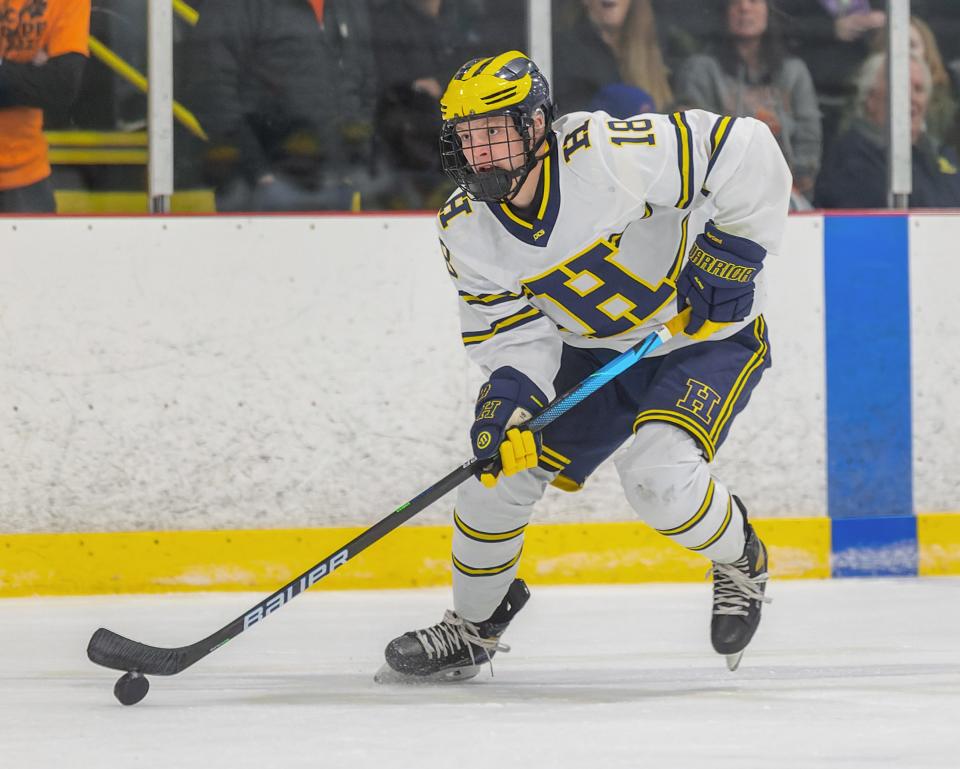 Jack L'Esperance scored his third goal of the game with 1:39 left in overtime, giving Hartland a 6-5 victory over Flint Powers Catholic.