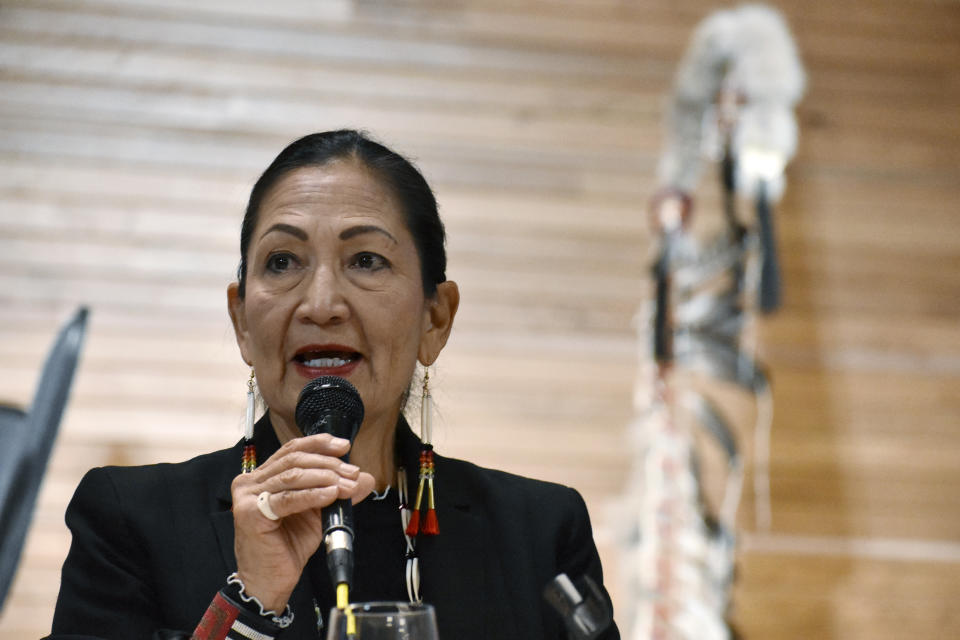 Interior Secretary Deb Haaland speaks at the opening of a session to hear from survivors of government-sponsored Native American boarding schools at Montana State University, Sunday, Nov. 5, 2023, in Bozeman, Mont. The Interior Department says more than 400 of the abusive, government-backed schools operated across the U.S. (AP Photo/Matthew Brown)
