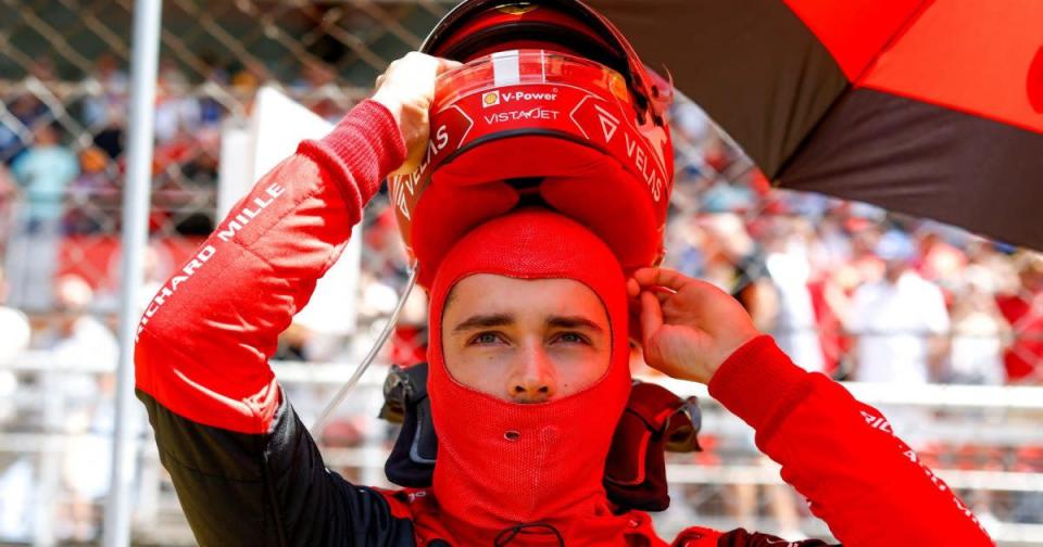 Charles Leclerc putting his helmet on. Barcelona, May 2022. Credit: PA Images