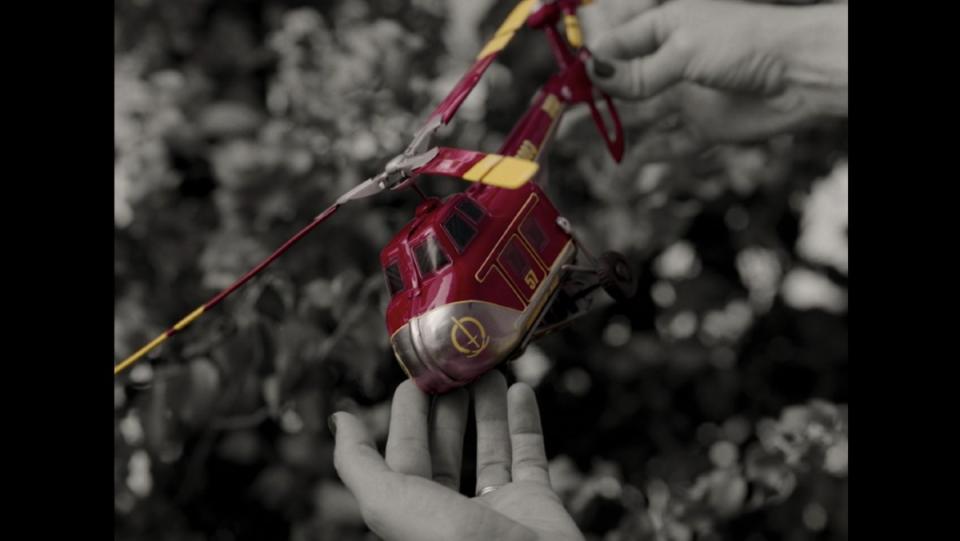 A red and yellow helicopter stands apart against a black-and-white setting in WandaVision.