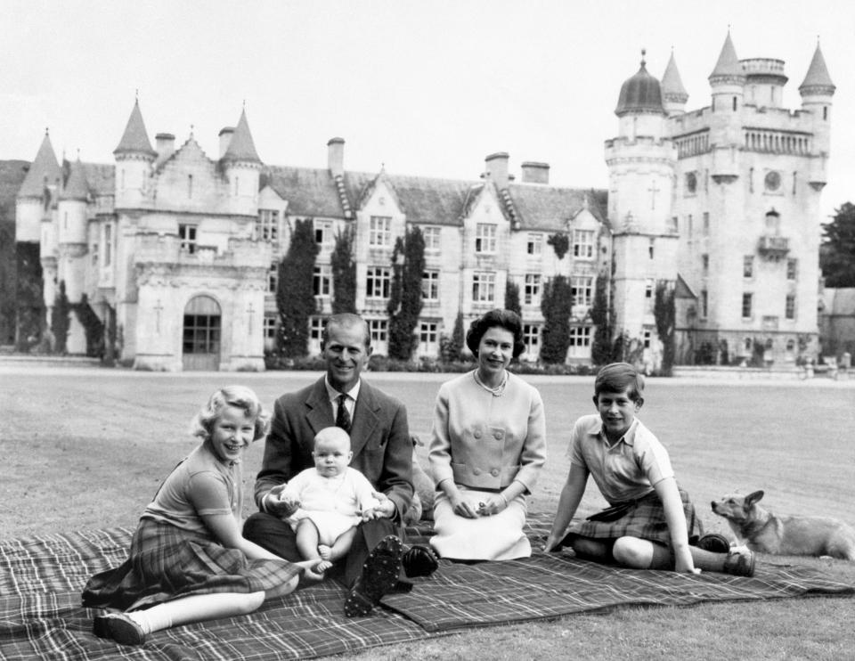 Making a happy group on the lawns at Balmoral, are the Queen, the Duke of Edinburgh and their three children Princess Anne, Prince Charles and baby Prince Andrew, on his father's knees.   (Photo by PA Images via Getty Images)
