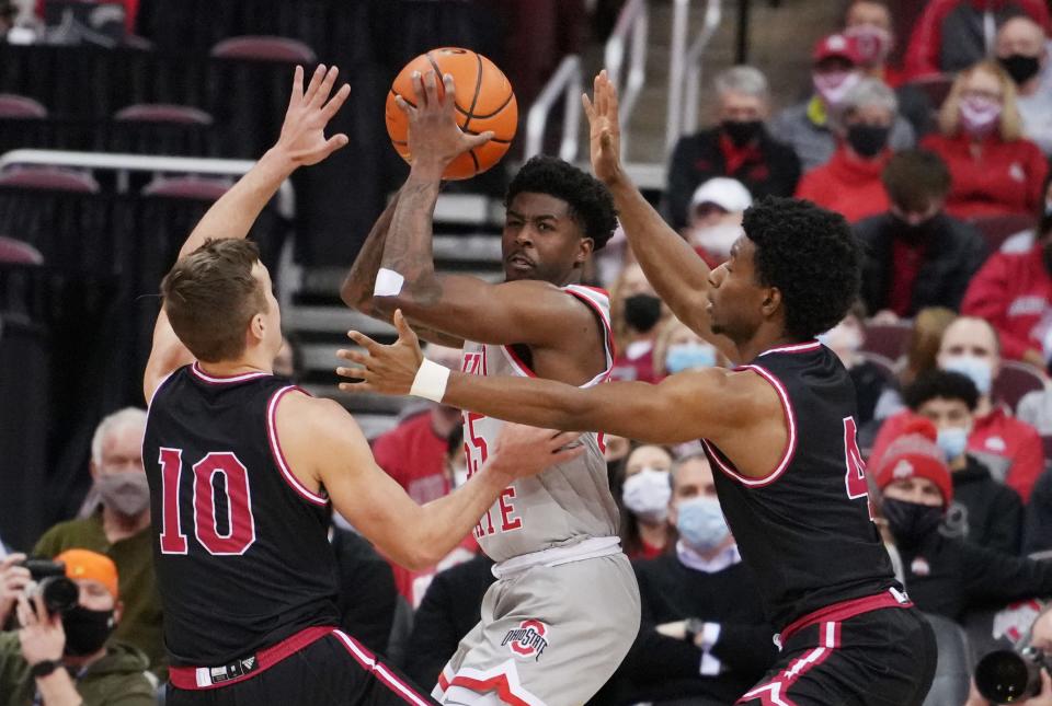 Ohio State's Jamari Wheeler fights through pressure from IUPUI defenders during the Ohio State vs. Indiana University/Purdue University Indianapolis men's basketball game Tuesday, January 18, 2022 at the Value City Arena in the Schottenstein Center.