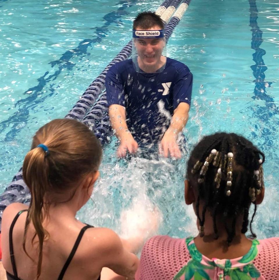 Zachary "Zach" Brown teaches children how to swim at the Petersburg Family YMCA.