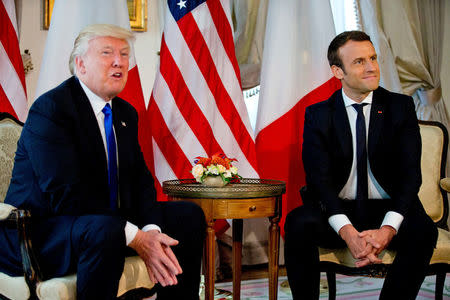 U.S. President Donald Trump (L) meets French President Emmanuel Macron before a working lunch ahead of a NATO Summit in Brussels, Belgium, May 25, 2017. REUTERS/Peter Dejong/Pool