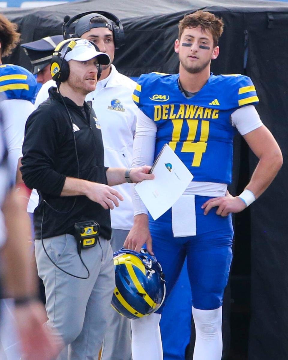 Delaware head coach Ryan Carty gives encouragement to his quarterback after Ryan O'Connor threw a fourth quarter interception in the Blue Hens' 33-27 loss to Elon at Delaware Stadium, Saturday, Nov. 4, 2023.