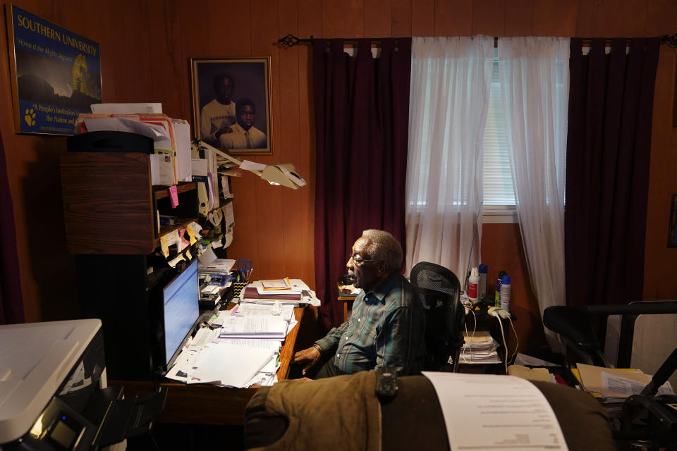 Press Robinson sits at his desk in his home in Baton Rouge, La., Wednesday, Aug. 24, 2022. When he registered to vote in 1963 he was handed a copy of the U.S. Constitution, told to read it aloud and interpret it. Robinson and activists say that Black voter voices and access to fair representation are once-again being restrained — this time, in the form of political boundaries fashioned by mainly white and Republican-dominated legislatures. (AP Photo/Gerald Herbert)