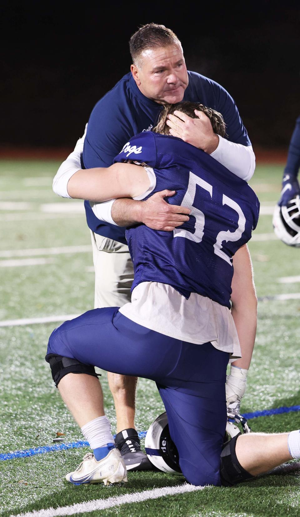 Rockland's Leary Costa is comforted at the conclusion of their game versus St. Mary's at Walpole High School on Friday, Nov. 18, 2022.   